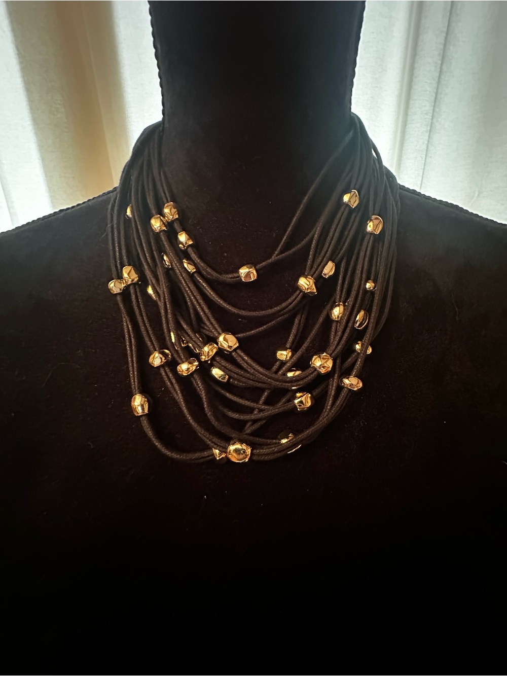 Multi-Strand Black Cord Necklace with Gold Bead Accents